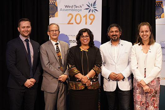 Speakers from WTA2019 together in front of banners