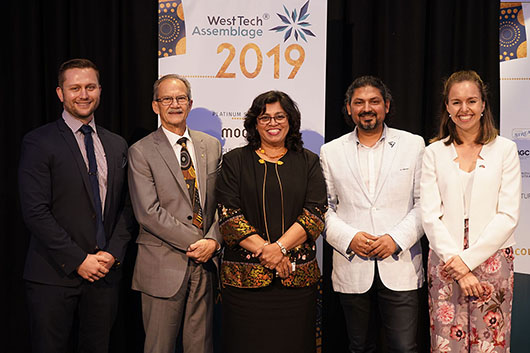 WTA 9 Speakers from WTA2019 together in front of banners