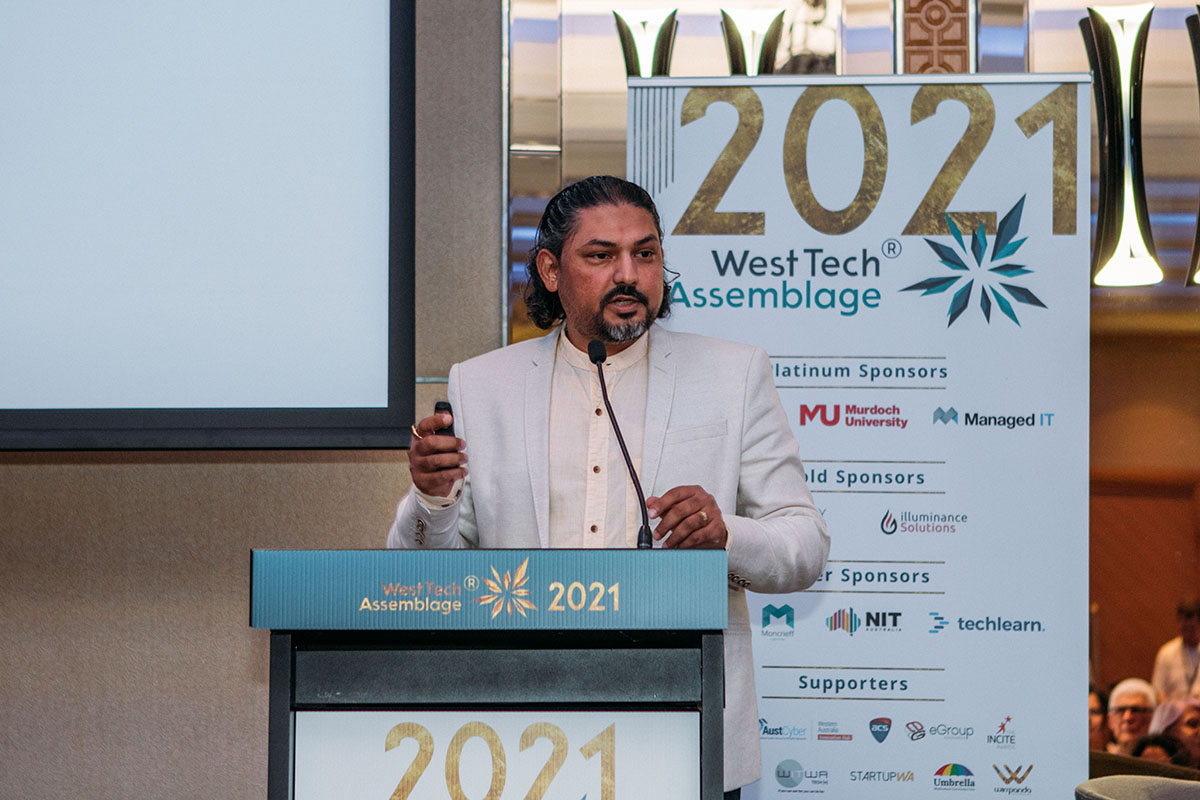 Nilesh Makwana speaking as Master of Ceremonies for West Tech Assemblage